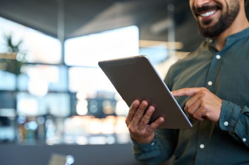 Man reading from an ipad